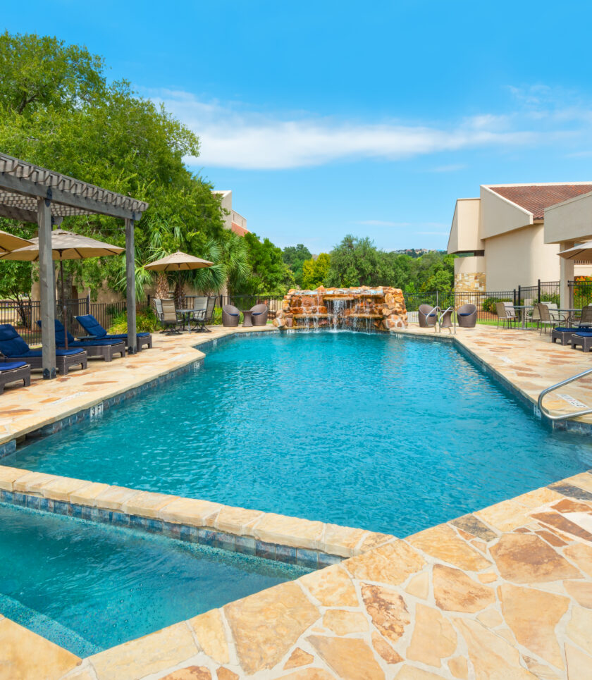 outdoor swimming pool with lounge chairs
