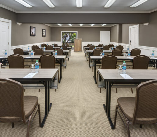meeting room with rows of tables and chairs