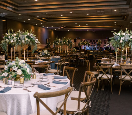 wedding banquet hall with decorated tables and flowers