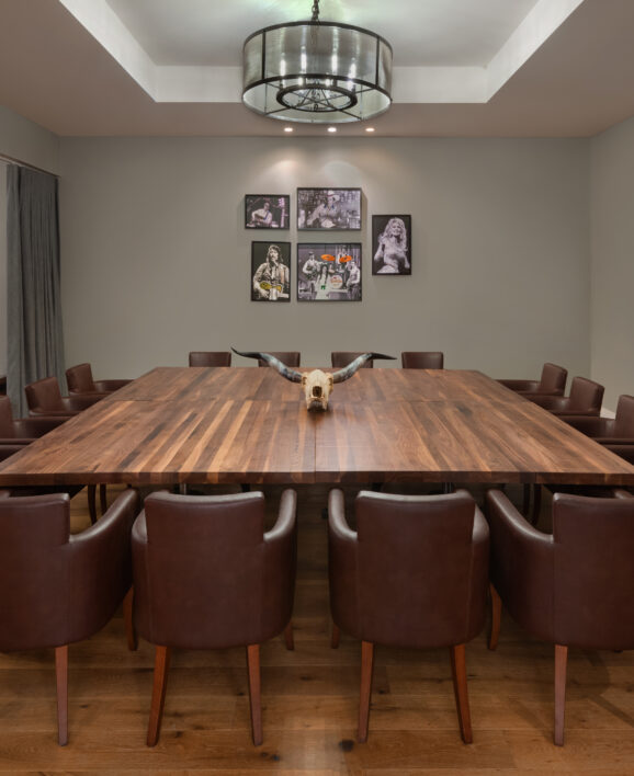 conference room with long wooden table and chairs