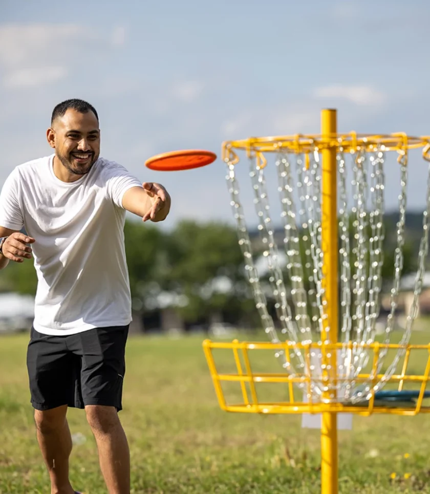 man playing disc golf outdoors