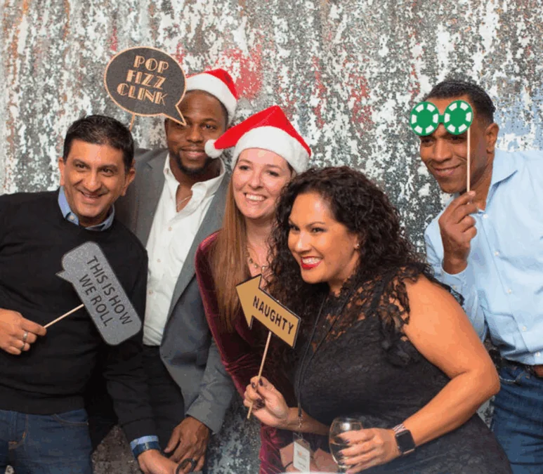 People with props taking holiday pictures