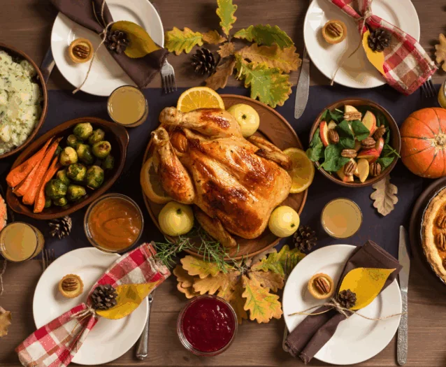 Table with Thanksgiving Turkey and side dishes
